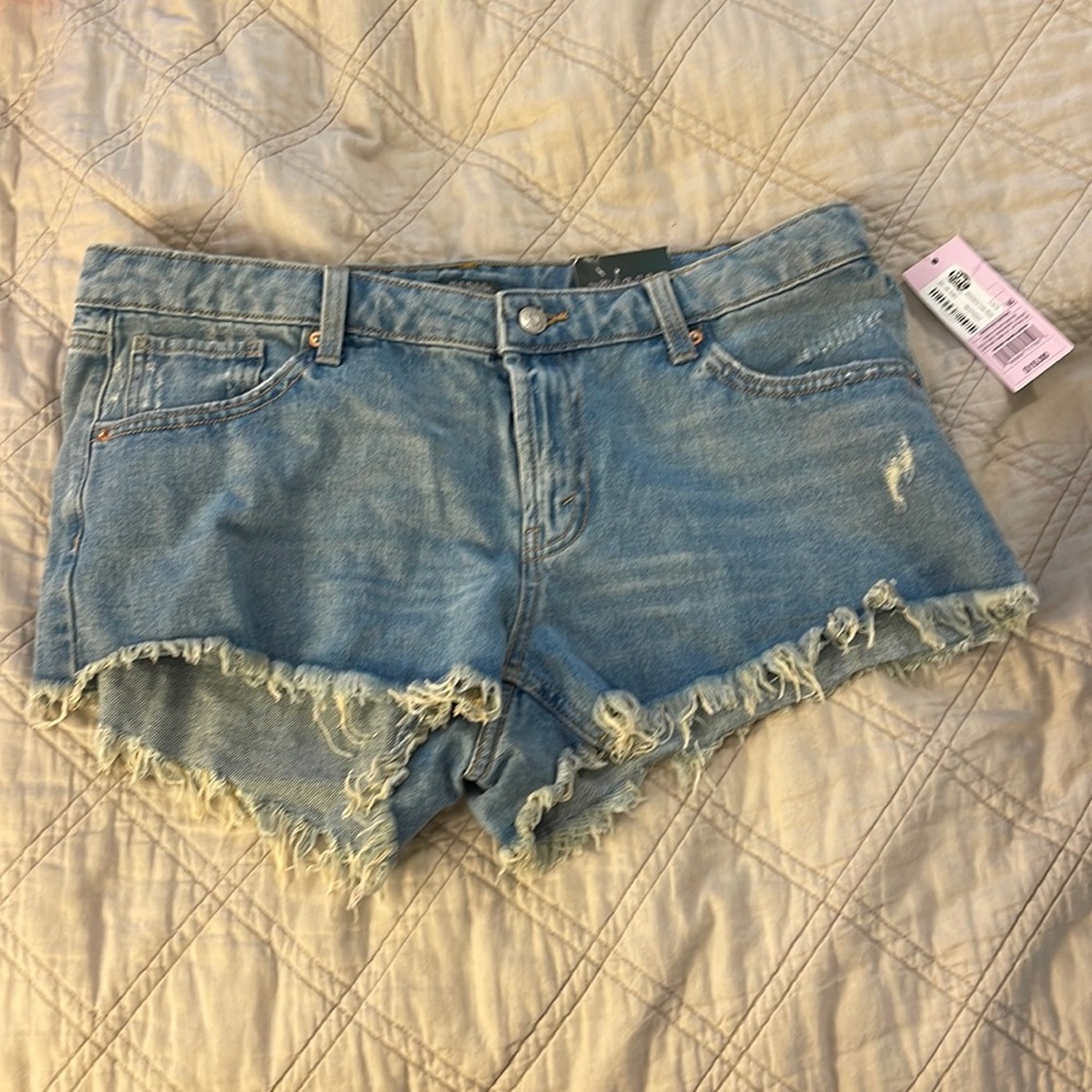 Blue jean shorts fringed hem